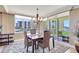Dining room with chandelier, water view and comfortable seating at 736 Island Way # 303, Clearwater Beach, FL 33767