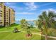 Stunning waterfront condo with lush landscaping, pool, boat docks, and views of the bay at 736 Island Way # 303, Clearwater Beach, FL 33767