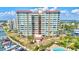 Luxury waterfront condominium featuring boat docks, a swimming pool, and immaculately kept landscaping at 736 Island Way # 303, Clearwater Beach, FL 33767