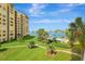Stunning waterfront condo with lush landscaping, pool, boat docks, and views of the bay at 736 Island Way # 303, Clearwater Beach, FL 33767
