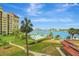 Stunning waterfront condo with lush landscaping, pool, boat docks, and views of the bay at 736 Island Way # 303, Clearwater Beach, FL 33767