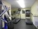 Community gym with treadmills, weight machines, and a water cooler at 736 Island Way # 303, Clearwater Beach, FL 33767
