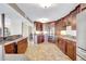 Spacious kitchen featuring tile floors, custom cabinets and granite countertops at 736 Island Way # 303, Clearwater Beach, FL 33767