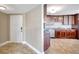 Open concept kitchen features custom cabinets, granite countertops, and stainless steel appliances at 736 Island Way # 303, Clearwater Beach, FL 33767