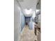 Functional laundry room with modern washer and dryer, white cabinets, and tiled flooring at 736 Island Way # 303, Clearwater Beach, FL 33767