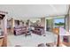 View of an open living space with a seating area, kitchen, and balcony with water views at 736 Island Way # 303, Clearwater Beach, FL 33767