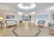 Elegant building lobby features tiled floors, comfortable seating, and serene decor for a welcoming entrance at 736 Island Way # 303, Clearwater Beach, FL 33767