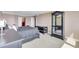 Bright main bedroom featuring a king bed, ample closet space, and neutral decor at 736 Island Way # 303, Clearwater Beach, FL 33767