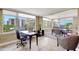 View of office and dining room area showcasing tile floors and expansive windows with water views at 736 Island Way # 303, Clearwater Beach, FL 33767