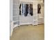 Large walk-in closet with custom shelving, providing ample storage for clothing and accessories at 736 Island Way # 303, Clearwater Beach, FL 33767