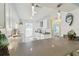 Modern kitchen with white cabinets, granite countertops, pendant lighting, and stainless steel appliances at 7822 Radcliffe Cir, Port Richey, FL 34668