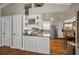 Eat-in kitchen boasting stainless steel appliances, white cabinetry and recessed lighting at 7944 Royal Hart Dr, New Port Richey, FL 34653