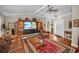 Spacious living room features a large entertainment center and comfortable seating at 7944 Royal Hart Dr, New Port Richey, FL 34653