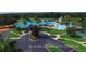 Aerial view of a 35-acre community complex with pool, clubhouse, and lush green landscaping at 8618 Snowy Owl Way, Tampa, FL 33647