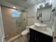 Modern bathroom with glass-enclosed shower and stylish vanity at 9921 Gulf Blvd, Treasure Island, FL 33706
