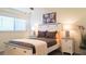 Bright and sunny bedroom with coastal accents and comfortable bedding at 9921 Gulf Blvd, Treasure Island, FL 33706