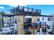 Stylish exterior features stone accents, multiple balconies, and rooftop deck access at 9921 Gulf Blvd, Treasure Island, FL 33706