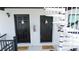 Exterior view of apartment doors with spiral staircase at 9921 Gulf Blvd, Treasure Island, FL 33706