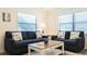 Cozy living room with comfortable seating, bright windows, and stylish decor at 9921 Gulf Blvd, Treasure Island, FL 33706