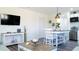 Open-concept living room and kitchen area featuring modern decor and furnishings at 9921 Gulf Blvd, Treasure Island, FL 33706