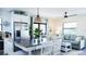 Cozy living area with dining table and seating, natural light, and calming color palette at 9921 Gulf Blvd, Treasure Island, FL 33706