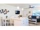 Open-concept kitchen and living area with modern decor and comfortable seating at 9921 Gulf Blvd, Treasure Island, FL 33706