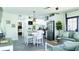 Inviting open-concept living space with modern decor, island seating, and stainless steel appliances at 9921 Gulf Blvd, Treasure Island, FL 33706