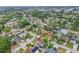 Aerial view of a residential neighborhood with lush green trees and well-maintained homes at 12110 75Th St, Largo, FL 33773
