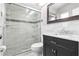 Updated bathroom featuring new vanity, large mirror, and glass enclosed shower with tile surround and skylight at 12110 75Th St, Largo, FL 33773
