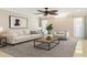 Bright living room featuring neutral tones, cozy seating, and stylish decor perfect for relaxing and entertaining at 12110 75Th St, Largo, FL 33773