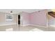 Open-plan living room with tile floors and view to stairs at 12110 75Th St, Largo, FL 33773
