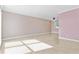 A view of the spacious living room with light pink walls and tile floors at 12110 75Th St, Largo, FL 33773