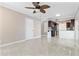 Open-concept living space with modern tile flooring, leading into a well-equipped kitchen with a breakfast bar at 12110 75Th St, Largo, FL 33773