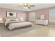 Serene main bedroom with natural light, a ceiling fan and calming color palette at 12110 75Th St, Largo, FL 33773