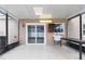 Covered patio space featuring tile flooring and a sink/counter area for outdoor convenience at 12110 75Th St, Largo, FL 33773