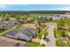 Aerial view of the home in a neighborhood, displaying a large lot and beautiful landscaping at 12280 Lyon Pine Ln, Odessa, FL 33556