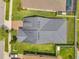 Drone shot showcasing the roof of the house and a large, landscaped backyard at 12280 Lyon Pine Ln, Odessa, FL 33556