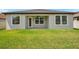 Well-maintained backyard with a covered patio and lush grass at 12280 Lyon Pine Ln, Odessa, FL 33556