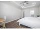 Bright bedroom leading to a bathroom and walk-in closet at 12280 Lyon Pine Ln, Odessa, FL 33556