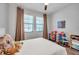 Comfortable bedroom with natural light and hardwood floors at 12280 Lyon Pine Ln, Odessa, FL 33556