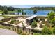 Overhead shot of community garden plots with a lake backdrop, showcasing an outdoor gardening space at 12280 Lyon Pine Ln, Odessa, FL 33556