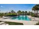 Relaxing community pool with clear blue water, poolside chairs, and well-manicured landscaping for a resort-style experience at 12280 Lyon Pine Ln, Odessa, FL 33556