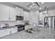 Well-equipped kitchen with stainless steel appliances, granite countertops, and a modern design at 12280 Lyon Pine Ln, Odessa, FL 33556