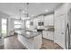 Bright kitchen with white cabinets, granite countertops, and stainless steel appliances at 12280 Lyon Pine Ln, Odessa, FL 33556