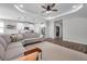 Open-concept floor plan showcasing the living room and kitchen with modern appliances and finishes at 12280 Lyon Pine Ln, Odessa, FL 33556