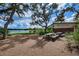 Inviting lakeside space with picnic tables and benches, perfect for relaxing and enjoying the scenic views at 12280 Lyon Pine Ln, Odessa, FL 33556