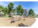 Fun playground area with slide, seesaw and other structures for to enjoy in a Gathering-friendly environment at 12280 Lyon Pine Ln, Odessa, FL 33556