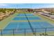 A view of multiple tennis courts, perfect for staying active and enjoying outdoor recreation at 12280 Lyon Pine Ln, Odessa, FL 33556