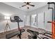 Bedroom currently being used as a workout room has neutral walls and plank flooring at 12280 Lyon Pine Ln, Odessa, FL 33556