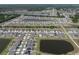 Expansive aerial view of a planned community featuring numerous homes and several ponds at 13227 Great Plains Dr, Riverview, FL 33579